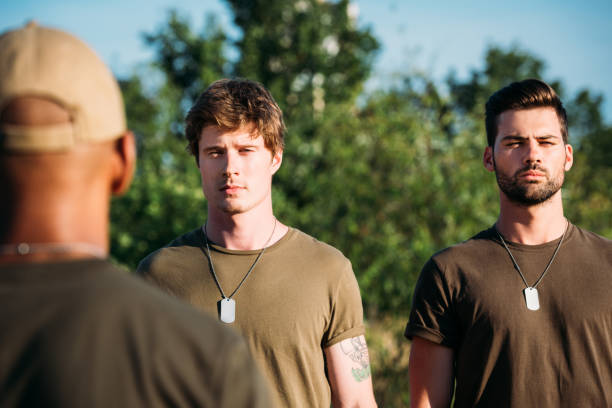 istock selective focus of confident young soldiers with tag dogs on range 1015375318