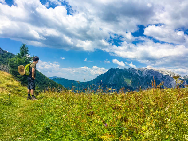 istock Young Man Enjoying Summer Hiking in the Mountains 1015388012
