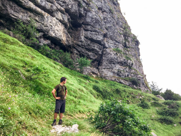 istock Young Man Relaxing himself Hiking on the Mountains 1015388150
