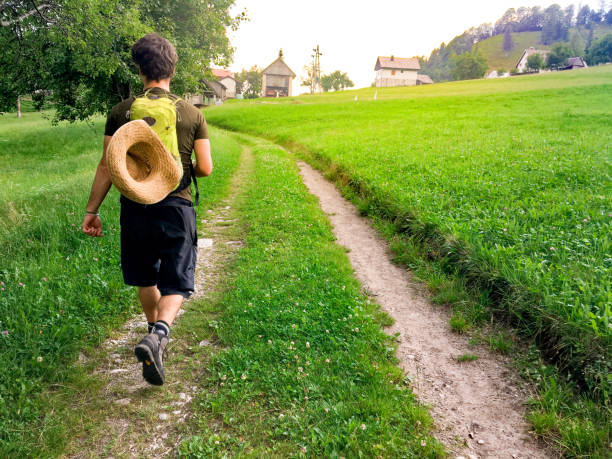istock Young Man Enjoying Summer Hiking Outdoors on Countryside 1015388364