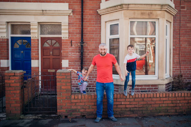 istock Posing for a Photograph with his Sons 1015394506
