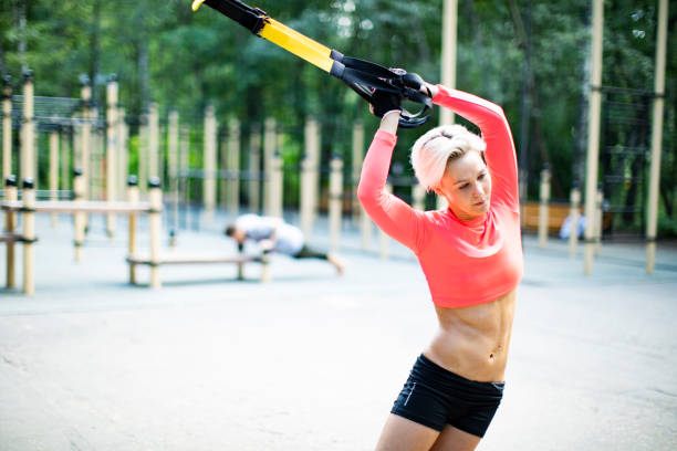 istock Young woman doing exercise outdoors 1015394532