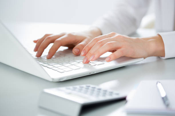 istock Businesswoman typing on a laptop. 1015404884