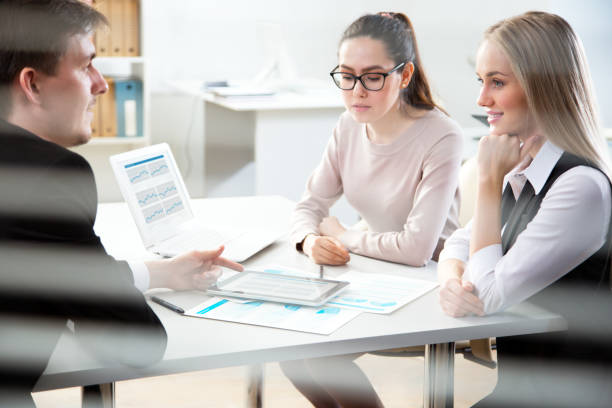 istock Young business people discussing a new project at a meeting 1015406216