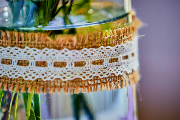 British Wedding venue showing bright floral contemporary flower arrangements, rustic table settings with place cards and meadow flowers alongside traditional and contemporary wedding favours