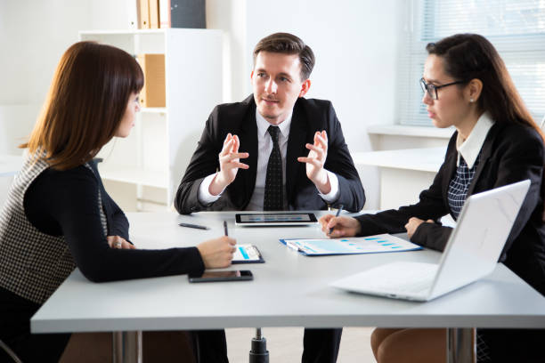 istock Young business people discussing a new project at a meeting 1015409464