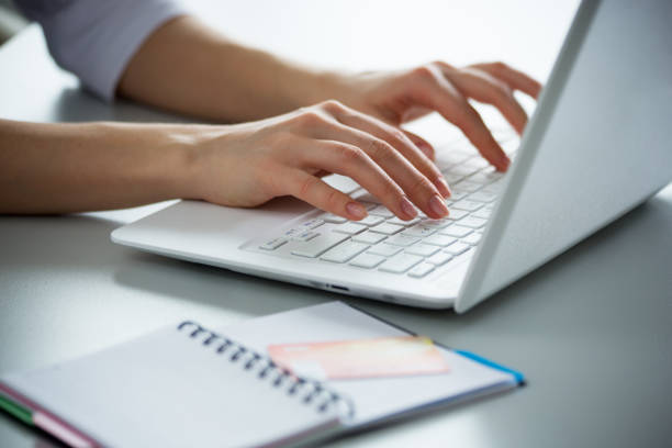 istock Businesswoman typing on a laptop. 1015410106