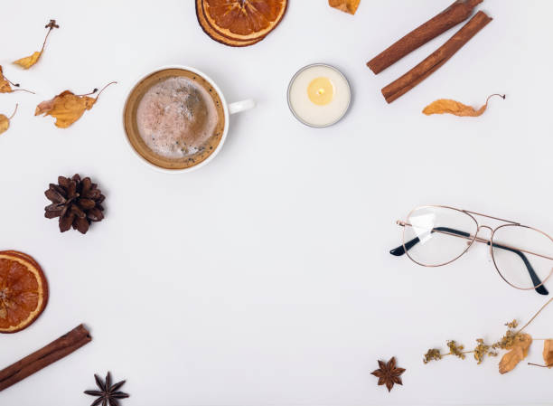 istock Cofffee, candle and dry spices and leaves on white background. 1015410340