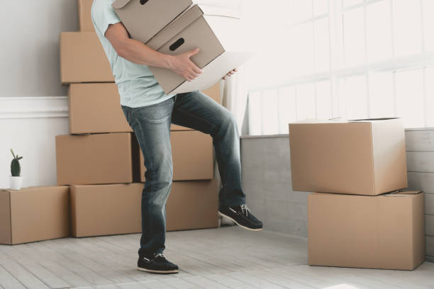 istock Close Up.Young Bearded Guy with Cardboard Boxes. 1015413294