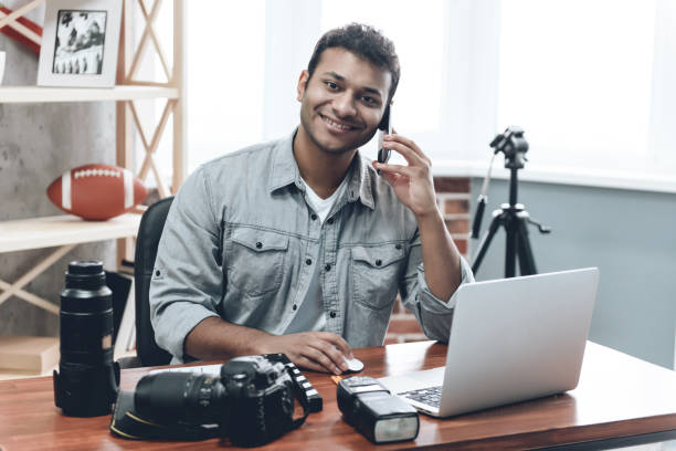istock Indian Happy Young Man Photographer Work from Home 1015413764