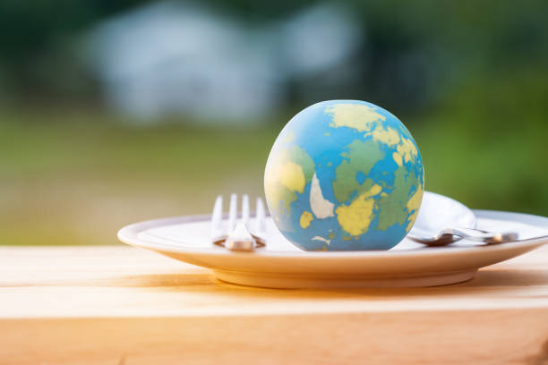 istock Globe model placed on plate with fork spoon for serve menu in famous hotels. International cuisine is practiced around the world often associated with specific region country. World food inter concept 1015413770