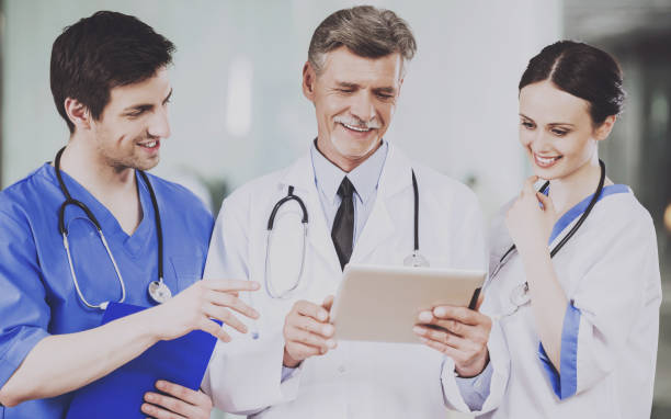 istock Team of Doctors with Stethoscopes in Uniform. 1015414332