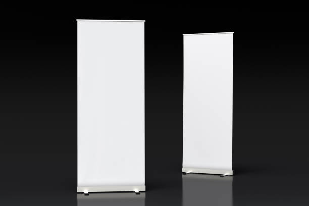istock blank roll up banner display stands on black 1015414428