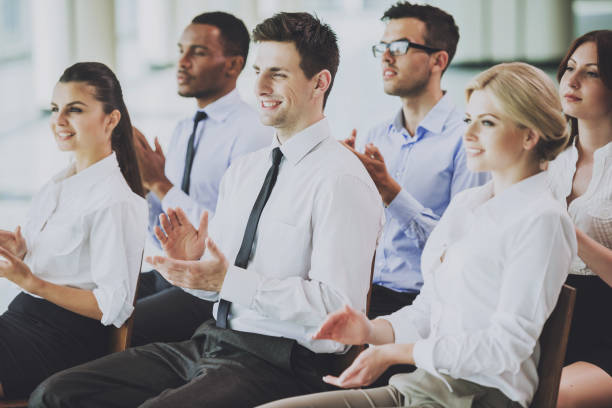 istock Team of Multiracial Businesspeople Clapping Hands. 1015414770