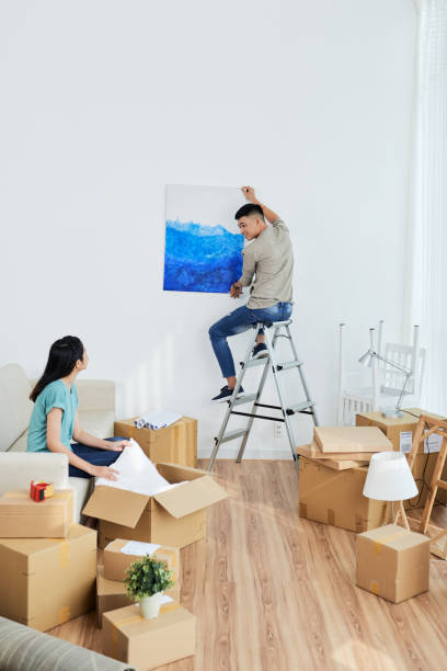 istock Young couple decorating new apartment 1015425520