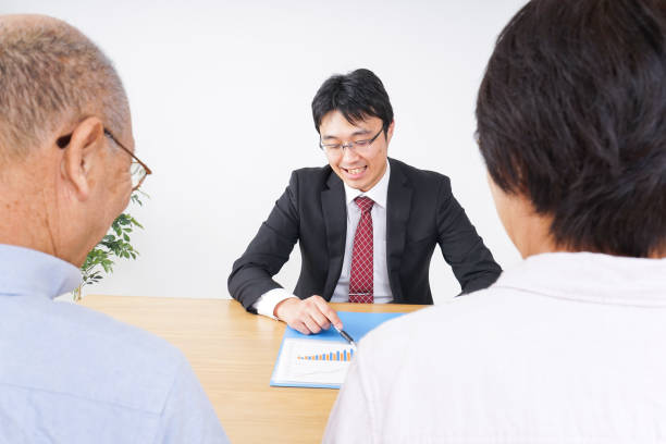 istock Aged couple and salesperson image 1015426954
