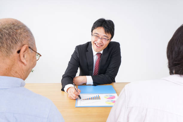 istock Aged couple and salesperson image 1015426964