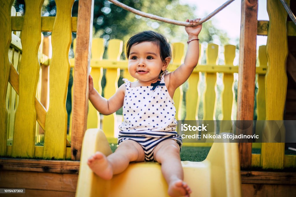 The baby is playing outside Baby - Human Age Stock Photo