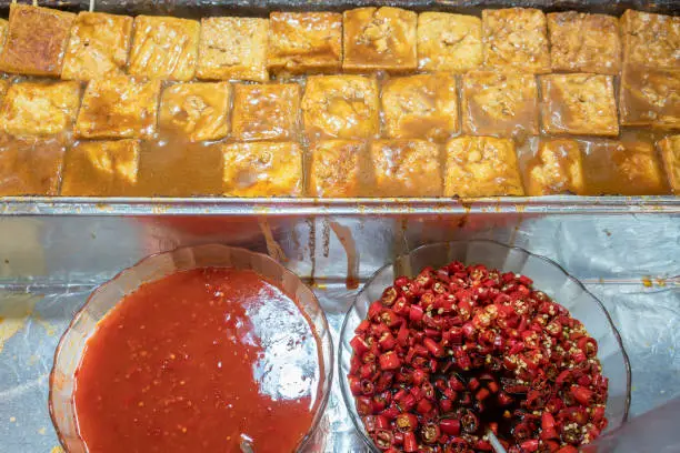 Photo of Popular stinky tofu with spicy sauce selling in the Jiufen , old street food market , New Taipei City , Taiwan