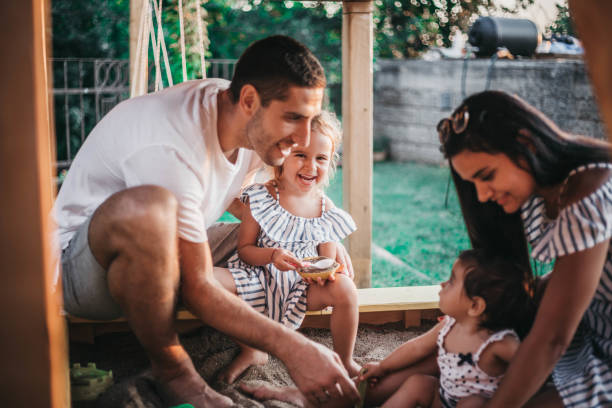 istock Family playing in the sandpit 1015438436