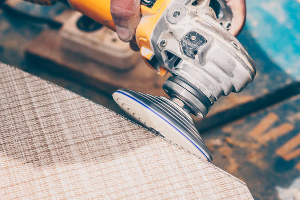 istock Tile works the tile polishing disk with diamond spraying for the angle grinder 1015441984