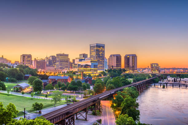 Richmond, Virginia, USA Skylinhe Richmond, Virginia, USA downtown skyline on the river at twilight. eastern usa stock pictures, royalty-free photos & images