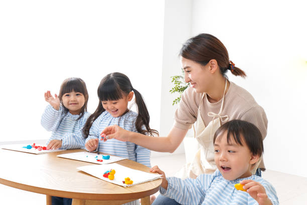 istock Children's nurse and kindergarten child 1015451376