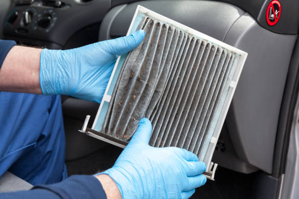 istock Replacing dirty cabin pollen air filter for a car 1015455644