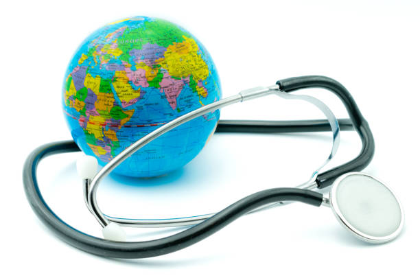 istock Globe and stethoscope on white background, environmental emergency concept, global health monitoring. 1015455888