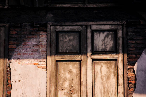 istock The wooden window is on an old brick wall. 1015474622