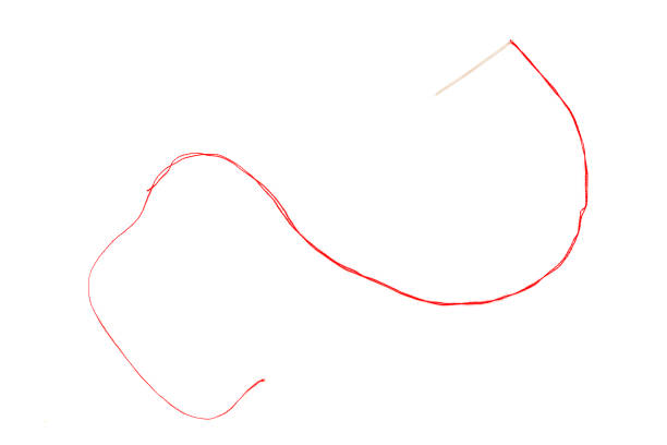 istock Overhead photo of a needle with a red thread on a white background 1015480472