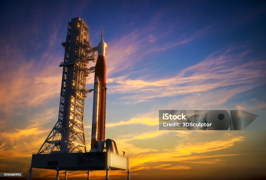 Space Launch System On Launchpad Over Background Of Red Clouds Space Launch System On Launchpad Over Background Of Red Clouds. 3D Illustration. NASA Images Not Used. Rocketship Stock Photo