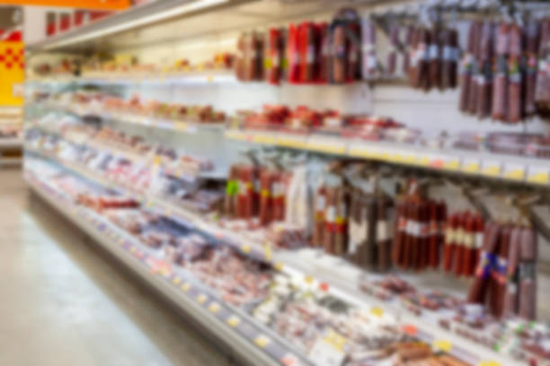 istock Blurred photos showcases shops. Long rows of racks with goods. 1015481894