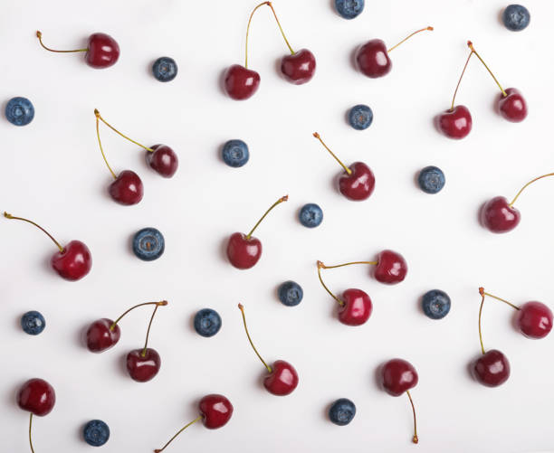 istock Cherries and blueberries on the white background 1015481906
