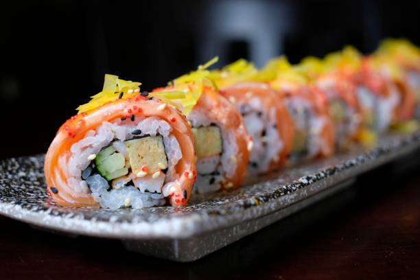 istock salmon sushi roll with spicy sauce 1015488664