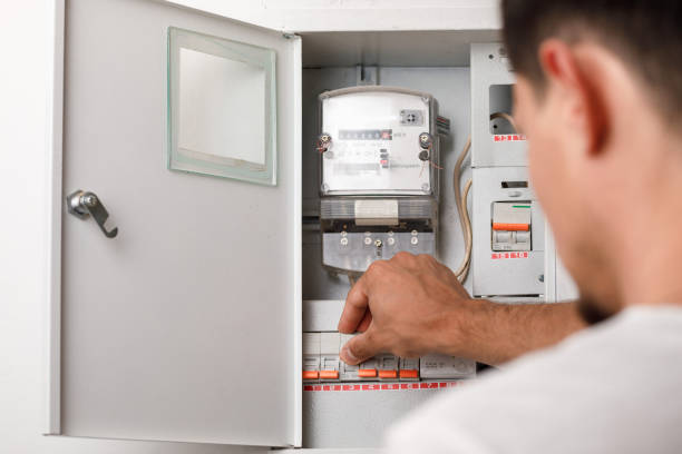istock Electrical terminal box. man turn on or off 1015488680
