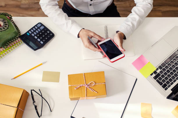 istock Man using smartphone. Delivery and receiving orders from customers online. 1015509620