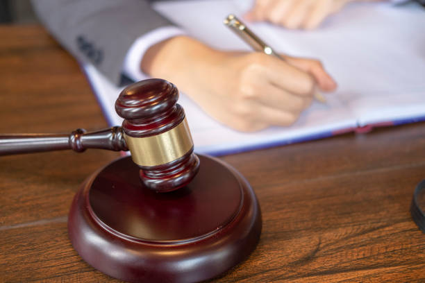 istock lawyer working on a documents, judge garvel 1015524124
