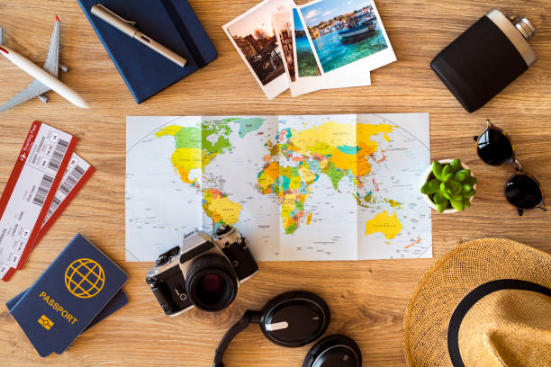 Ready for travel Travel accessories on a wooden desktop. attraction studio photography stock pictures, royalty-free photos & images