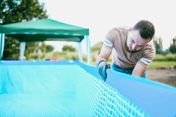 istock Male Worker Checking If The Pool Is Properly Balanced 1015534958