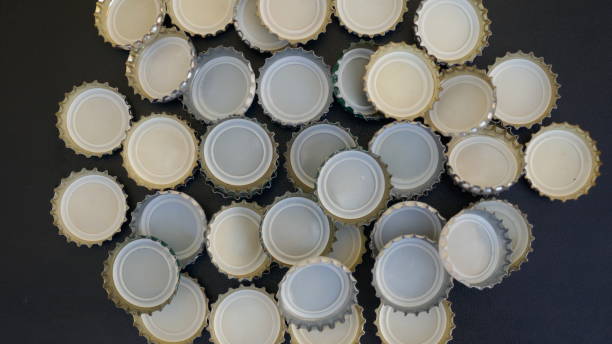 istock Many small bottle caps on black background. Close up,texture,background 1015538002