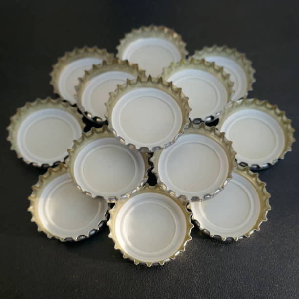istock Many small bottle caps on black background. Close up,texture,background 1015538212
