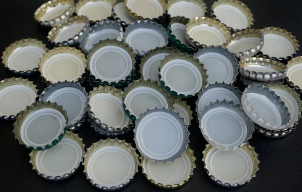 istock Many small bottle caps on black background. Close up,texture,background 1015538738
