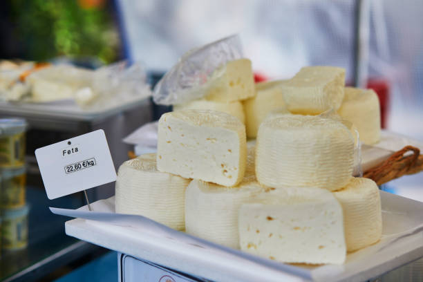 Feta cheese on farmer market in Paris, France. Typical European market of home grown produce