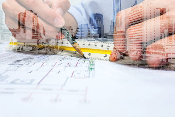 Double exposure engineer drawing and city Double exposure engineer are measuring distance in drawing using pencil and ruler and city. Abundance stock pictures, royalty-free photos & images