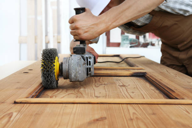 istock carpenter work the wood with the sander grinding electric tools for rustic renovate 1015564984