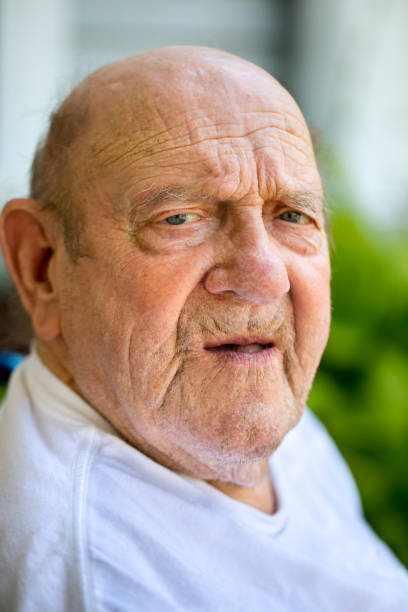 istock Elderly man head shot looking in to camera 1015577142