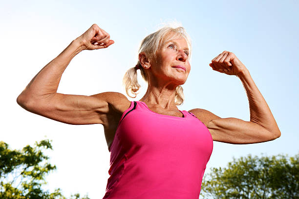 340+ Senior Woman Flexing Muscles Stock Photos, Pictures & Royalty