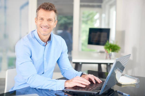 istock Businessman using laptop in the office 1015589190