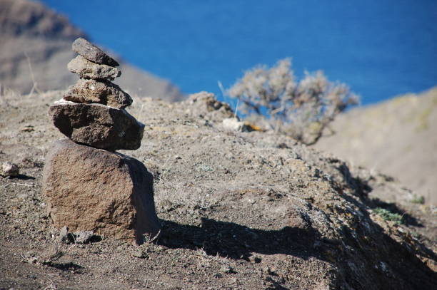 istock Small pyramid of stones at the cliffs at Gran Canaria 1015594554